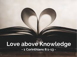 The black and white image of an open book with pages on either side turned into middle to reveal a heart shape. The words "Love above Knowledge - 1 Corinthians 8: 1-13" are written below the book.