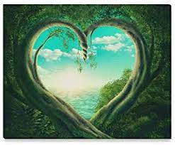 The image is a blue, partly cloudy sky over an ocean looking through a vine wall. The opening is in the shape of a heart.