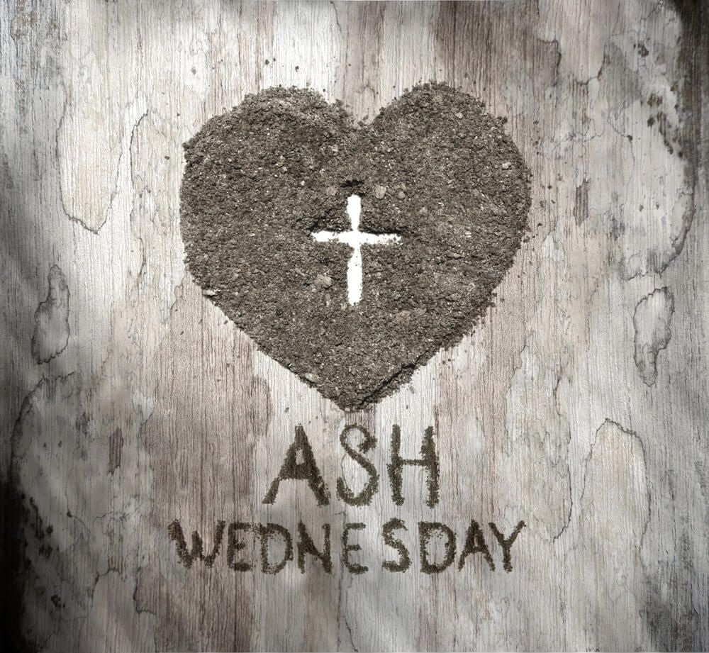 An image of a heart made in ash and an empty cross in the middle. The text " Ash Wednesday" is below.